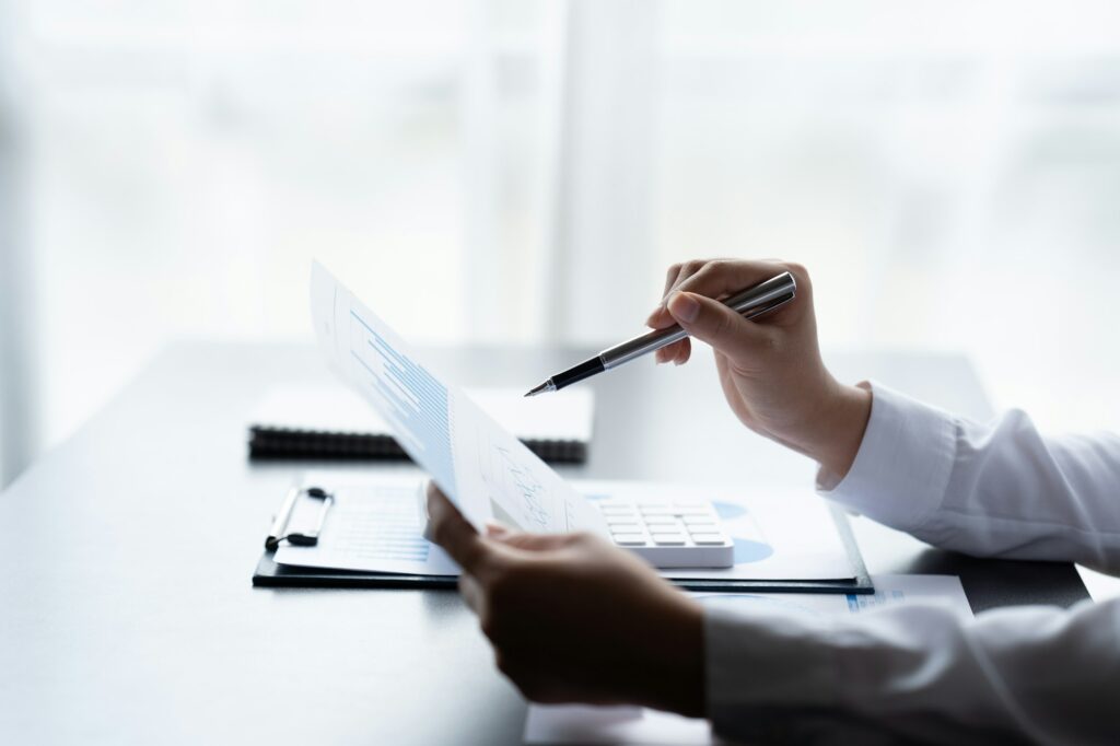 Businessman Accounting Calculating Cost Economic Financial data.